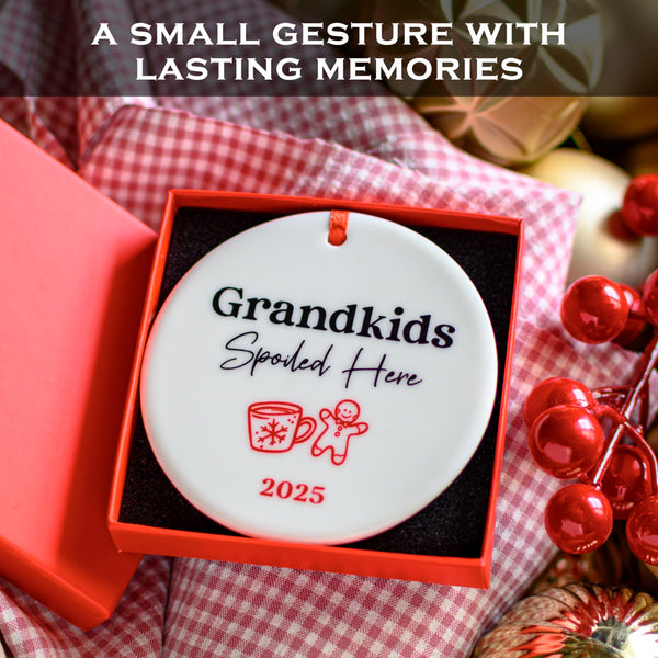 Decorative ornament with 'Grandkids Spoiled Here 2025' text in a red box on a checkered fabric background.