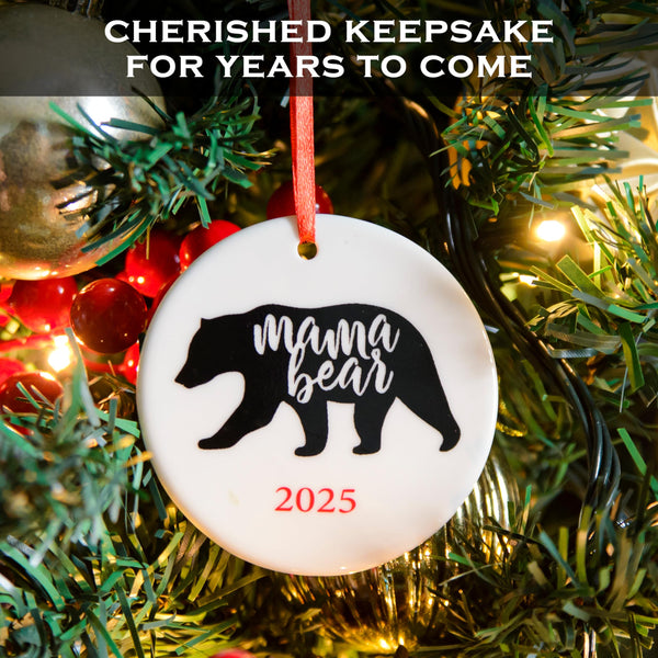 Christmas ornament with 'mama bear' design and year on a tree