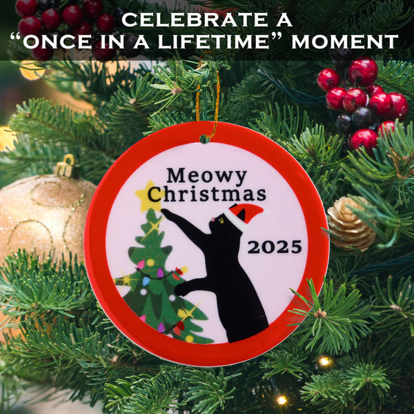 Decorative Christmas ornament with a cat and tree design, surrounded by festive greenery and ornaments.