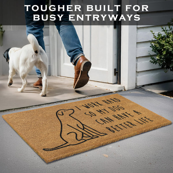 Doormat with dog design and text, person stepping onto it, dog watching from outside.