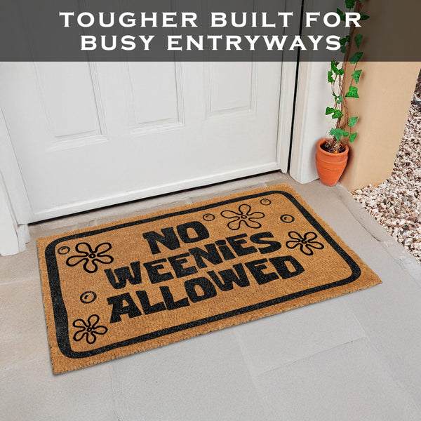Doormat with 'No Weenies Allowed' text in front of a white door.