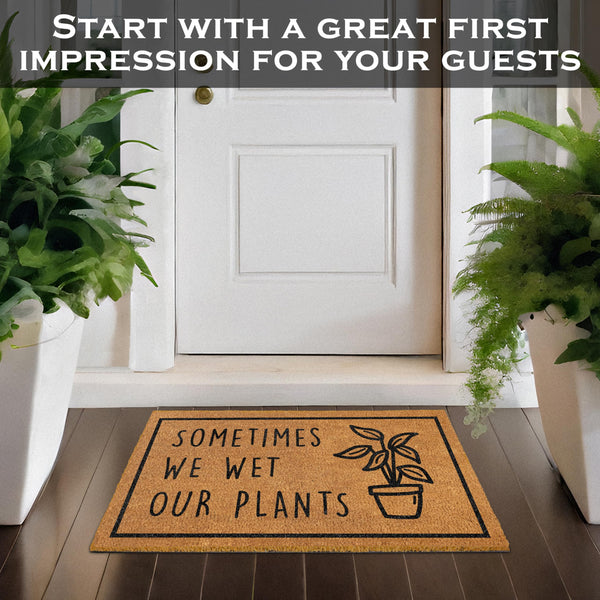 Doormat with humorous plant-themed text in front of a white door, flanked by potted plants.