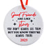 Round white ornament with red and black text on a white background