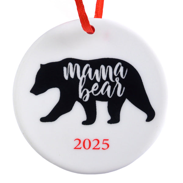 Round white ornament with black 'mama bear' silhouette and red '2025' text on a white background