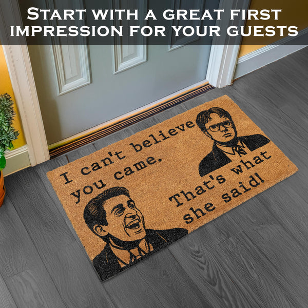 Doormat with humorous quote and images of two men on a wooden floor.