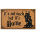 Doormat with text 'It's not much but it's Home' and a house silhouette on a white background