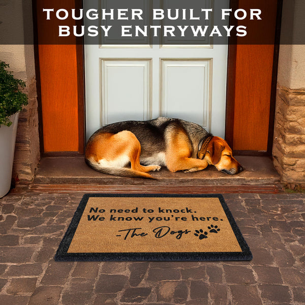 Dog lying on a doormat with text 'No need to knock. We know you're here.' at the entrance of a house.