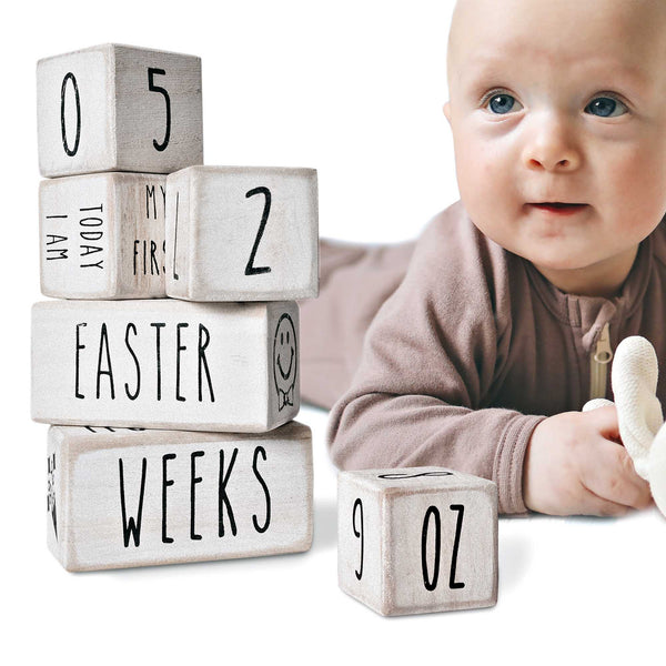 white baby monthly milestone blocks baby age