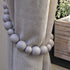products/tiebacks_grey_LS_03_wood-bead-curtain-tieback-set-of-2-curtain-holdback-tie-curtain-pull-back-holder-tieback-hooks-drape-beaded-boho-gray.jpg